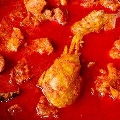 A picture of Fiery Red Chicken Curry Recipe | MURGIR LAAL JHOL | Bengali Spicy Chicken Recipe.