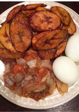 A picture of Dodo(fried plantain) with boil eggs n pepper sauce.