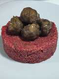 Quinotto de beterraga y espárragos con albóndigas