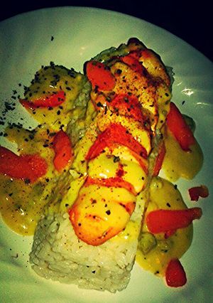 A picture of Rosemary Chicken & Rice w/ Broccoli and Cheese Sauce.