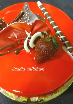 A picture of Pineapple cake with orange mirror glaze.