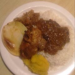 A picture of Grilled turkey with rice.