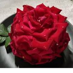 A picture of Eggless rose cake in cooker.