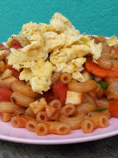 A picture of Macaroni with Orinji Mushroom and Tomato Sauce.