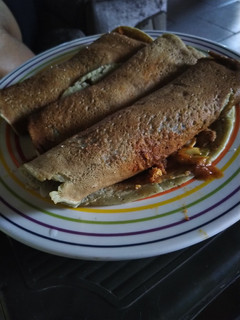 A picture of Banana pancake with vegetable sauce.