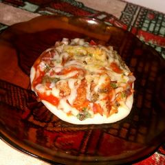 A picture of Chicken nugget green gram pizza.