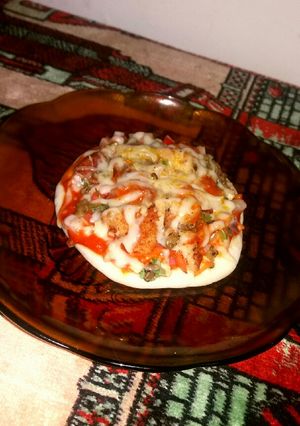 A picture of Chicken nugget green gram pizza.