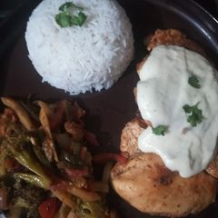 A picture of Steak with veggie and boiled rice.