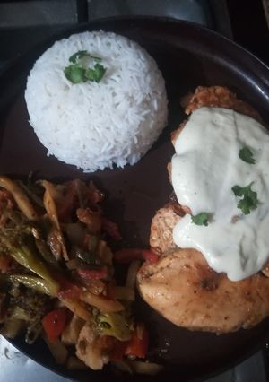 A picture of Steak with veggie and boiled rice.