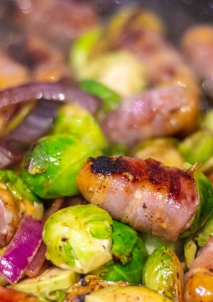 A picture of Pig in Blankets and Brussel sprouts with sweet plum sauce.
