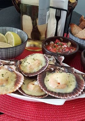 Una foto de Ostiones a la parmesana