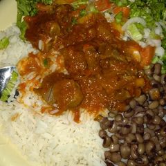 A picture of Rice and beans with soup.