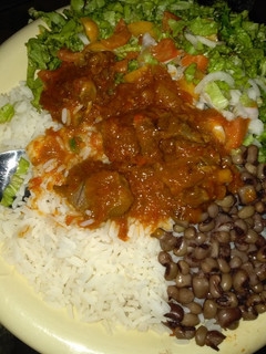 A picture of Rice and beans with soup.
