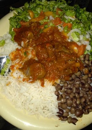 A picture of Rice and beans with soup.