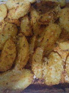 Una foto de Papas gratinadas con queso parmesano