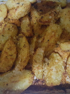 Una foto de Papas gratinadas con queso parmesano