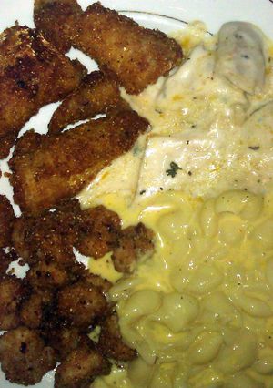 A picture of Fried catfish & shrimp, Sauteed Alfredo tilapia & mac n cheese.