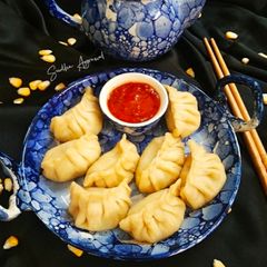A picture of Momos with Corn and Veggies stuffing.