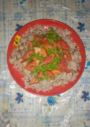 A picture of Rice and Beans with Salad.