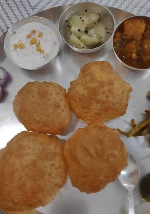 A picture of Dal Kachori with Aloo Kumdha Sabzi.
