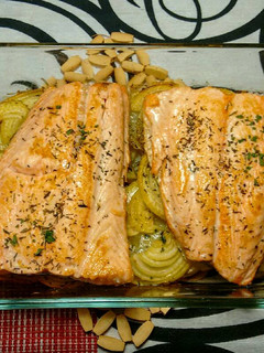 A picture of Baked Salmon with Potatoes and Onions.