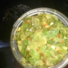 A picture of Green chilli paste in bottles save for bakraeid.
