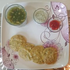 A picture of Moong dal stuffed veggie idli.