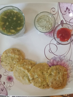 A picture of Moong dal stuffed veggie idli.