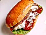 Maritozzo con Pomodori Secchi Burrata Filetti di Alici e Basilico