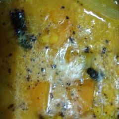 A picture of Moong daal with bottle gourd and pumpkin.