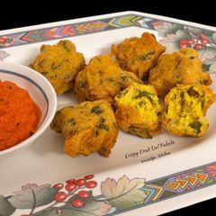 A picture of 🌧️ Crispy Urad Dal Pakode | Fluffy Inside, Crisp Outside | Monsoon Tea-Time Special.