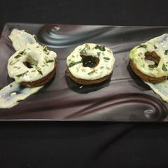A picture of Atta Spinach doughnut with Paan Rabdi dip.