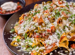 Una foto de Nachos Mexicanos