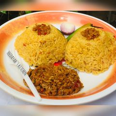 A picture of Jallop rice with egg sauce.