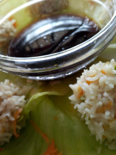 A picture of Chicken rice balls with soy dip.