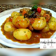 A picture of Chicken and potatoes soup.