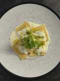 Ravioli ricotta e spinaci con crema al parmigiano