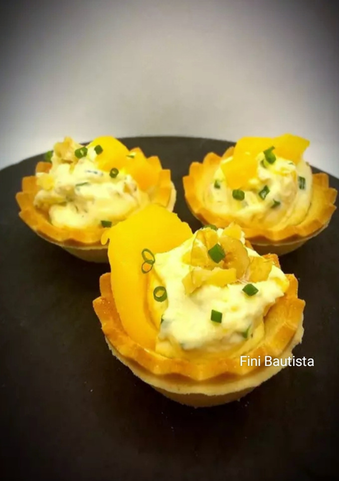 Una foto de Canapés de queso crema y mango