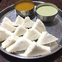 A picture of Triangle Idli & Sambar & Coconut chutney.