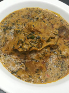 A picture of Groundnut soup with bitterleaf.