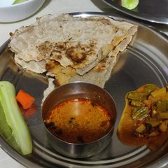 Sorgam bhakri (flat bread) with ridge gourd and potato sabji A picture of Sorgam bhakri (flat bread) with ridge gourd and potato sabji.