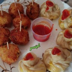 A picture of Veg Lollipop and Momos.