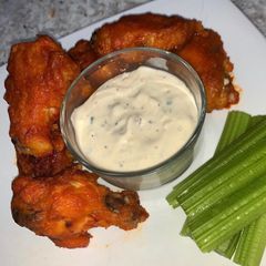 A picture of Buffalo Wings with home-made Blue Cheese Dip.
