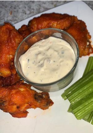 A picture of Buffalo Wings with home-made Blue Cheese Dip.