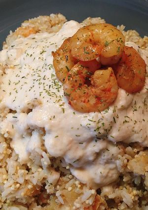 Foto di Mix di riso, miglio e quinoa con code di gambero speziate