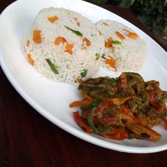 A picture of White rice with beef & veggies sauce.