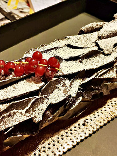 Una foto de Tronco de Navidad (Enrollado - Brazo de la Reina) de Chocolate
