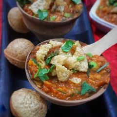 A picture of Tamatar chaat banarasi famous street food tasty and spicy.