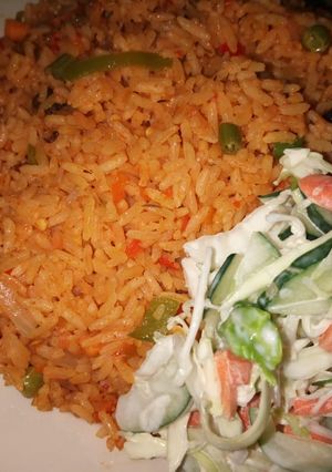 A picture of Veggies rice with veggies salad.