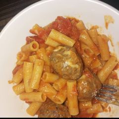 Penne pasta in tomato meatball sauce A picture of Penne pasta in tomato meatball sauce.